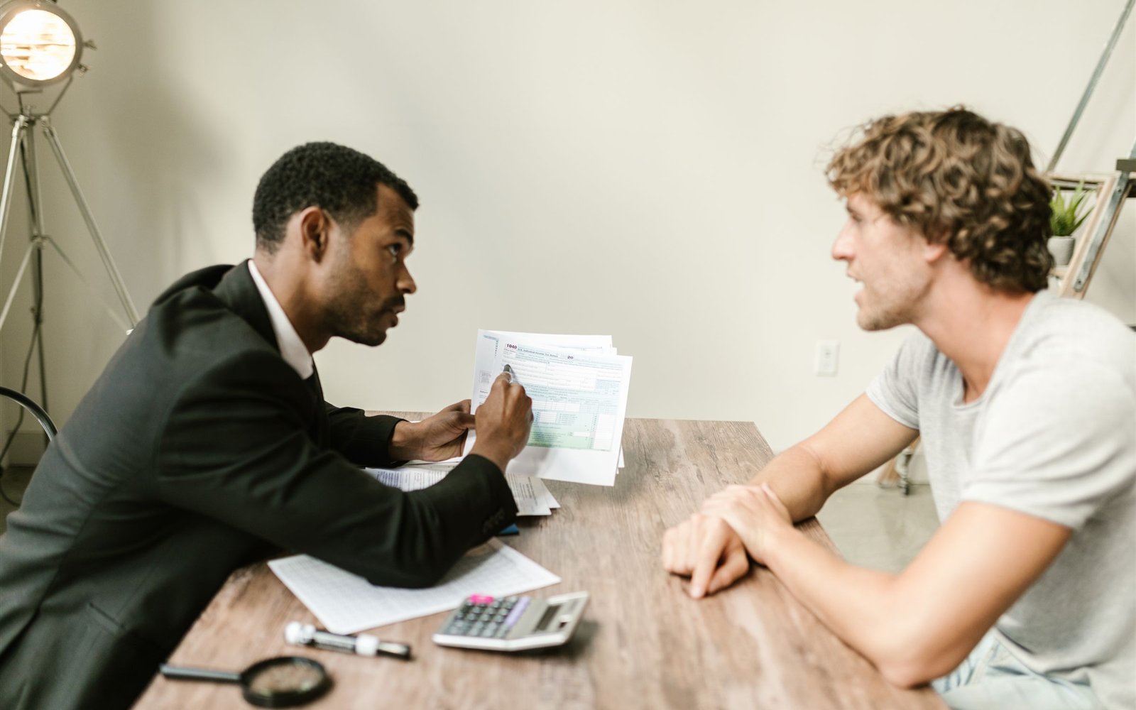 Advisor reviewing financial documents with a client