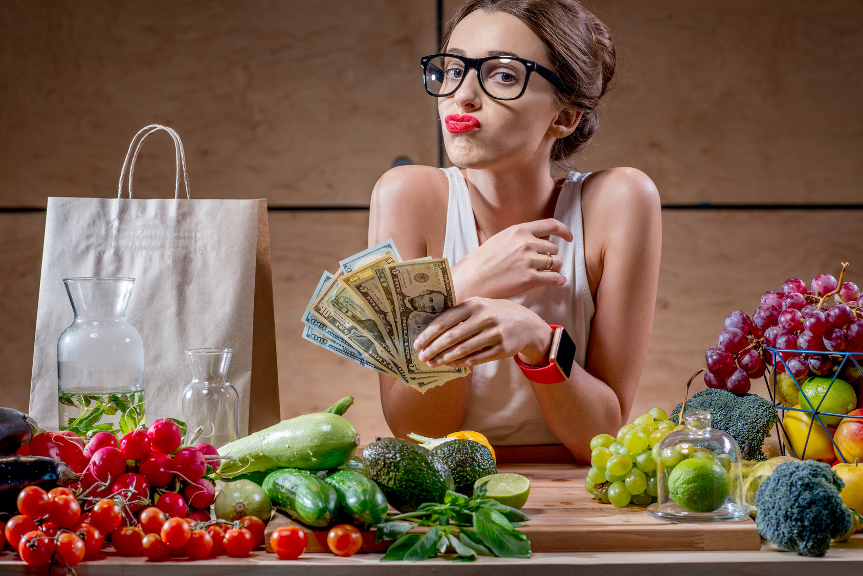 Lady drops money on groceries