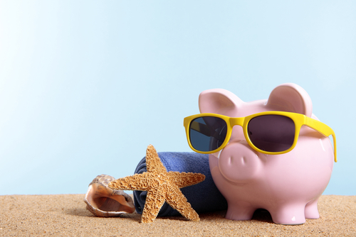 A piggy bank goes on a beach vacation.