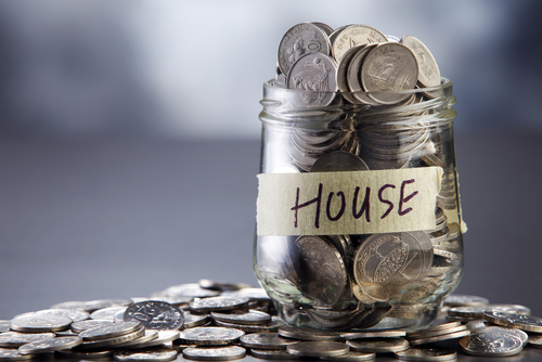 Jar of money labeled house.